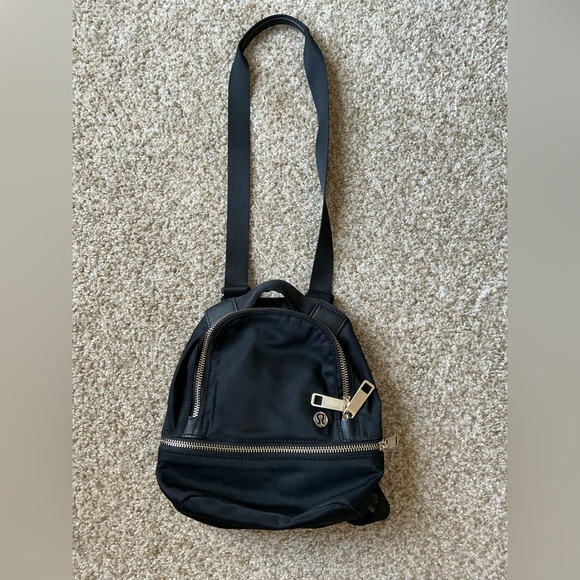 Lululemon Backpack / Crossbody Combo - Black with gold zippers/detail. - Picture 1 of 5